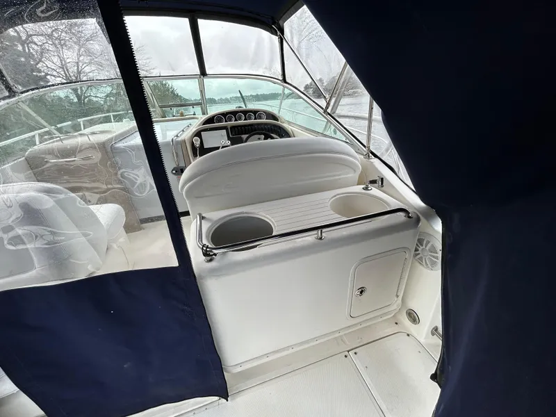 Slide: The Image of 2005 Sea Ray 290 Amberjack boat interior with helm and seating area. - 5