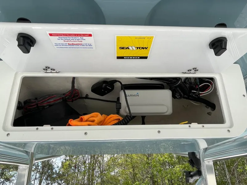 Slide: The Image of Storage compartment of 2022 Sea Hunt 234 Ultra boat with equipment and accessories. - 22