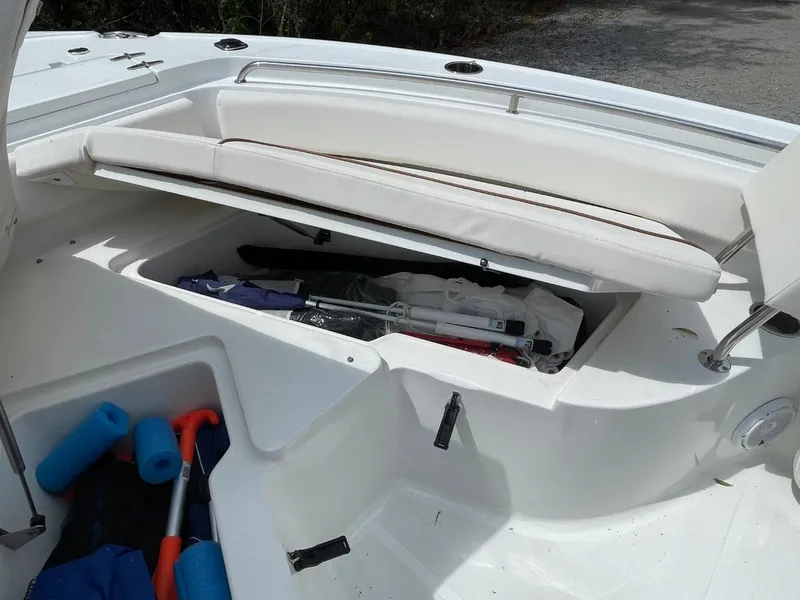 Slide: The Image of Storage compartment on a 2022 Sea Hunt 234 Ultra boat with open seating. - 29