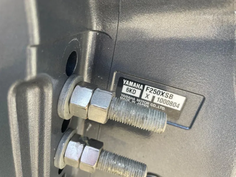 Slide: The Image of Close-up of Yamaha F250XSB engine bolts on 2022 Sea Hunt 234 Ultra boat. - 49