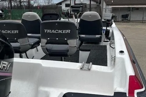 Slide: The Image of 2001 Bass Tracker TARGA 1900 Fiberglass Walleye Boat interior with seating and motor. - 14
