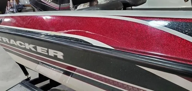 Slide: The Image of 2001 Bass Tracker TARGA 1900 Fiberglass Walleye Boat with red and black detailing. - 4