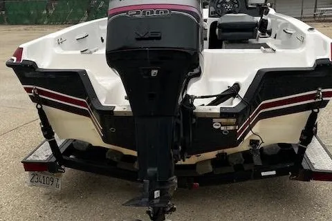 Slide: The Image of 2001 Bass Tracker TARGA 1900 Fiberglass Walleye Boat, rear view with motor. - 9