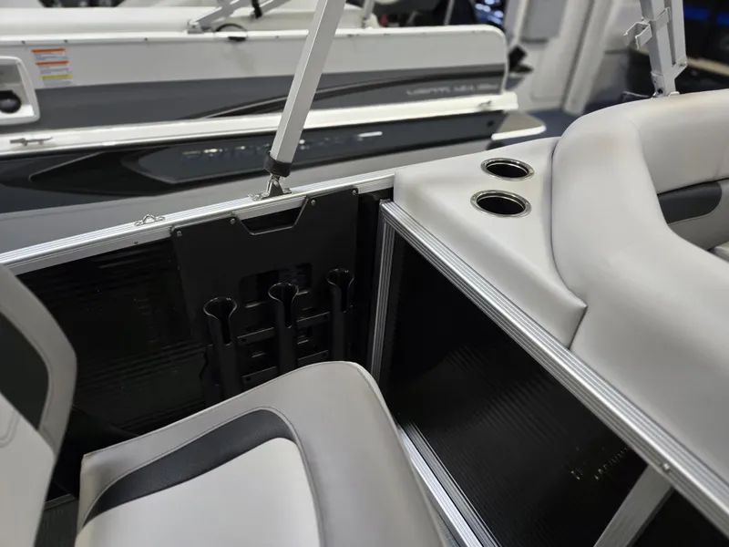 Slide: The Image of 2025 Princecraft Sportfisher 21-2RS boat interior with cup holders and seating. - 13