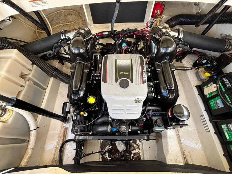 Slide: The Image of Engine compartment of a 2013 Sea Ray 250 SLX boat, featuring a powerful motor. - 12