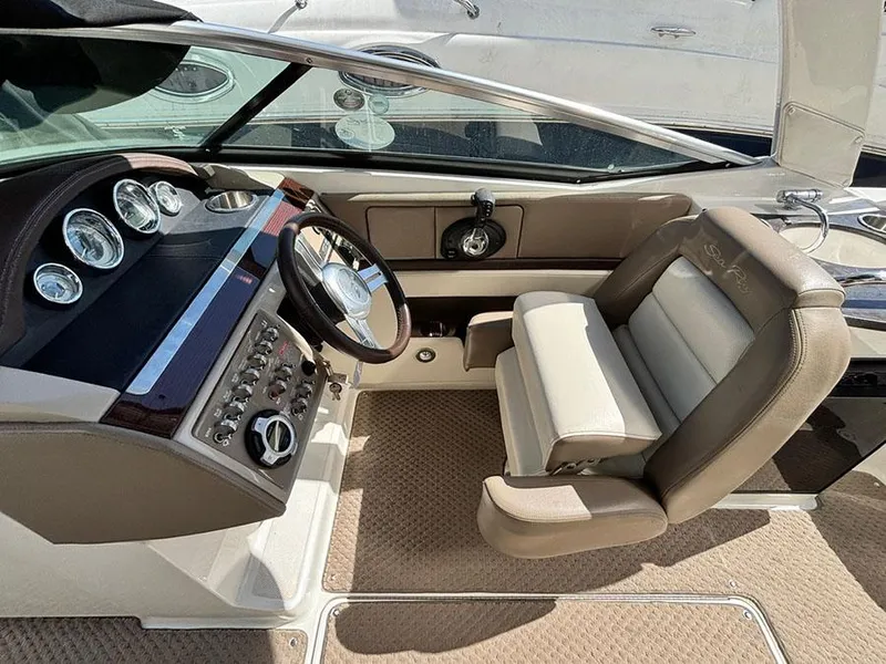 Slide: The Image of Interior of 2013 Sea Ray 250 SLX boat with steering wheel and captain's chair. - 22