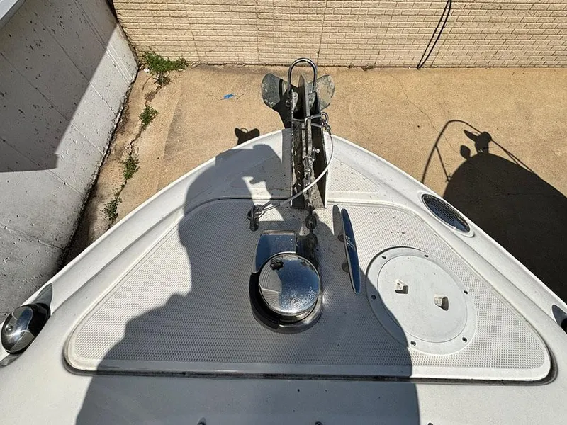Slide: The Image of Bow view of a 2013 Sea Ray 250 SLX boat with anchor and deck details. - 29
