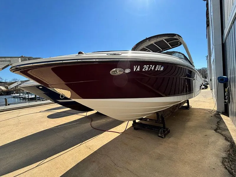Slide: The Image of 2013 Sea Ray 250 SLX boat on a trailer, parked outdoors. - 5