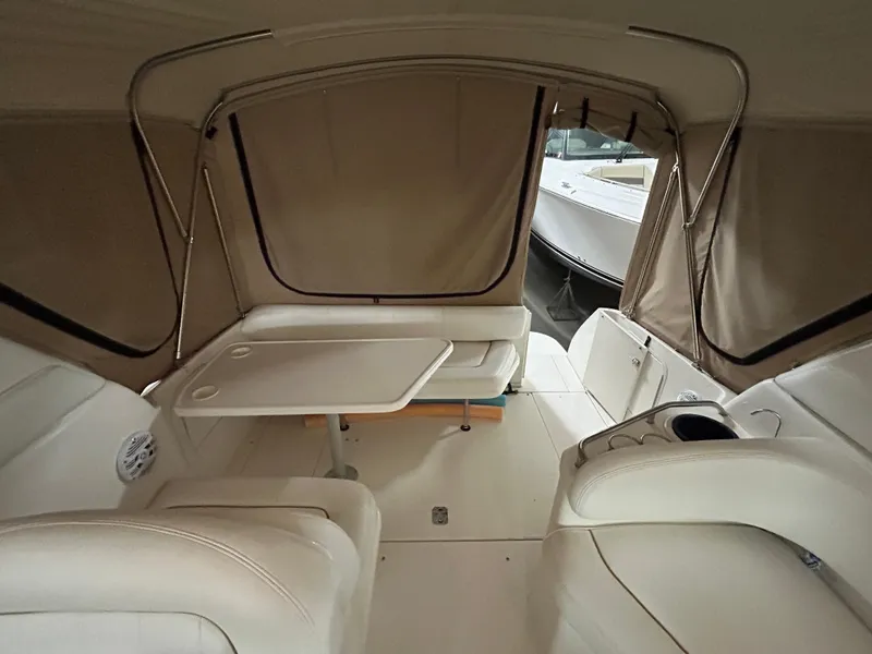 Slide: The Image of Interior of 2000 Sea Ray 290 Sundancer boat with seating and table. - 16