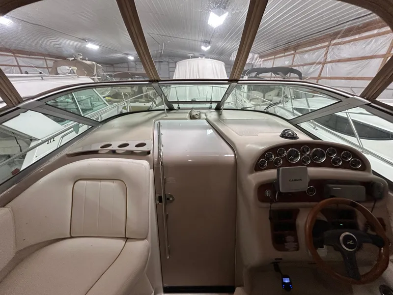 Slide: The Image of Interior view of 2000 Sea Ray 290 Sundancer boat cockpit with steering wheel and dashboard. - 20