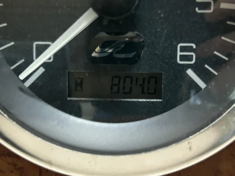 Slide: The Image of Close-up of a Sea Ray 290 Sundancer 2000 boat gauge displaying 8040 hours. - 23