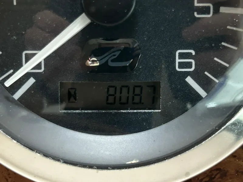 Slide: The Image of Close-up of a Sea Ray 290 Sundancer 2000 boat gauge displaying 808.7 hours. - 24