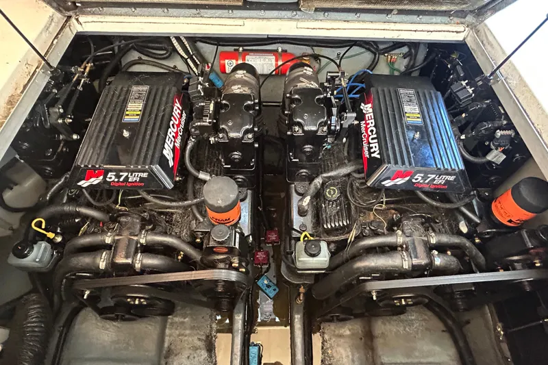 Slide: The Image of Twin Mercury 5.7L engines in a 2000 Sea Ray 290 Sundancer boat. - 45