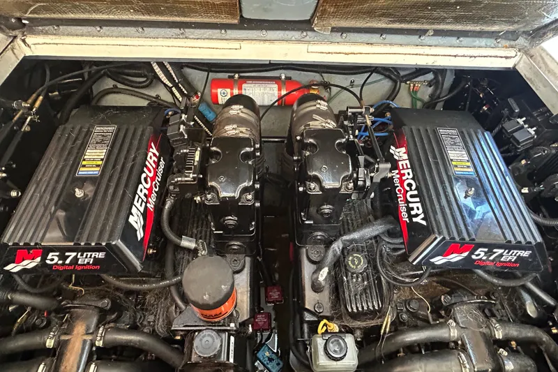 Slide: The Image of Twin Mercury engines in a 2000 Sea Ray 290 Sundancer boat. - 46