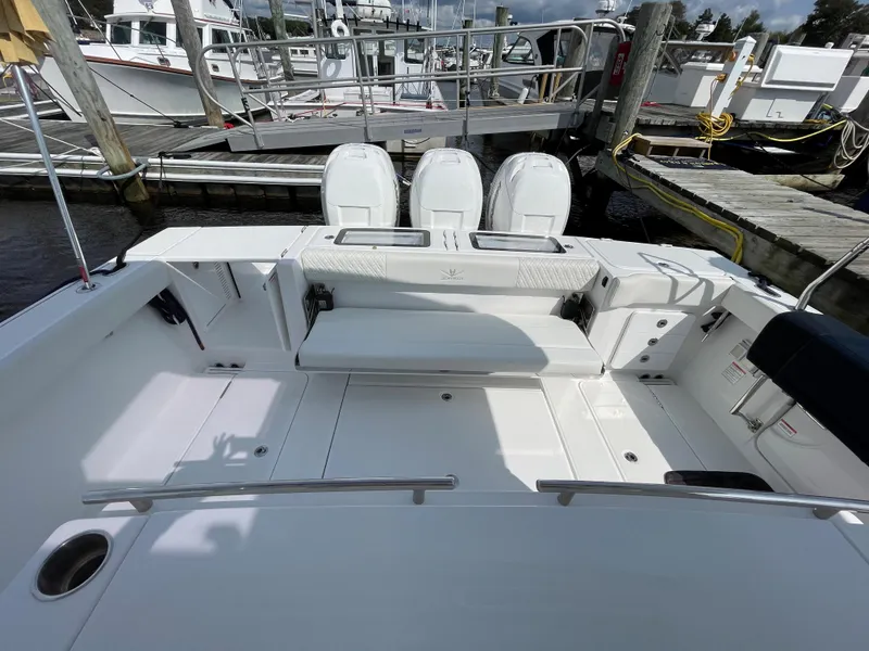 Slide: The Image of 2022 Bertram 39 CC boat with triple engines docked at marina. - 14