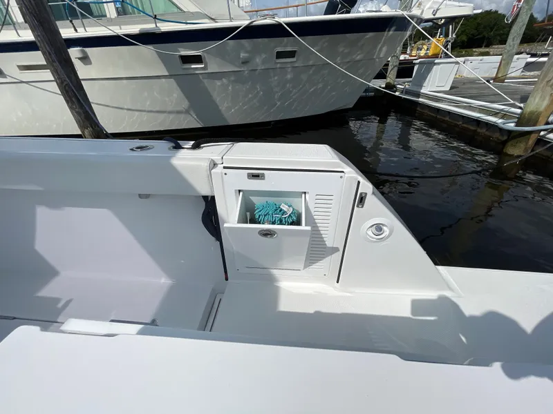 Slide: The Image of 2022 Bertram 39 CC boat interior with storage compartment at marina. - 21