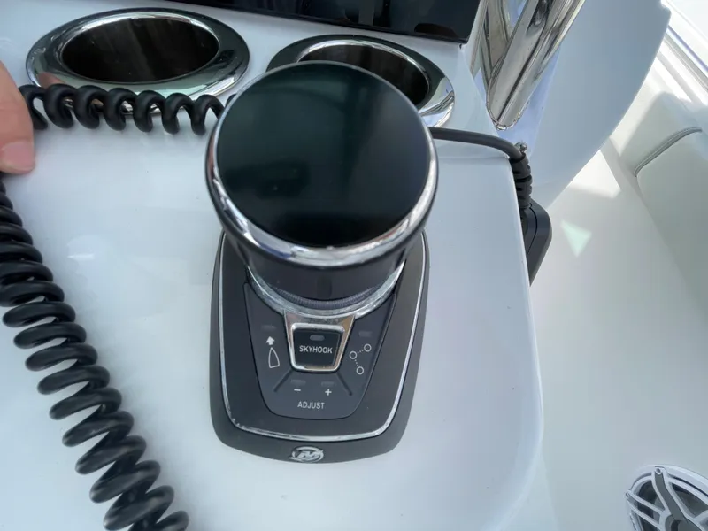 Slide: The Image of Joystick control on 2022 Bertram 39 CC boat dashboard. - 41