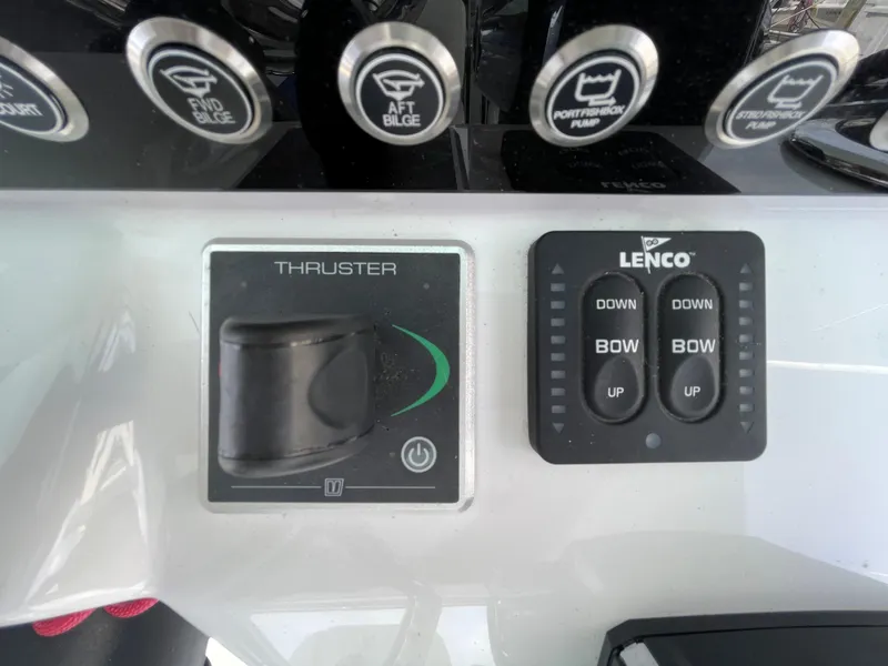 Slide: The Image of Control panel of a 2022 Bertram 39 CC boat with thruster and Lenco trim tabs. - 42