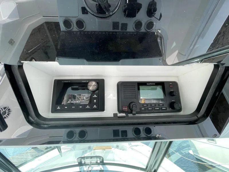 Slide: The Image of Control panel of 2022 Bertram 39 CC boat with navigation and communication systems. - 43