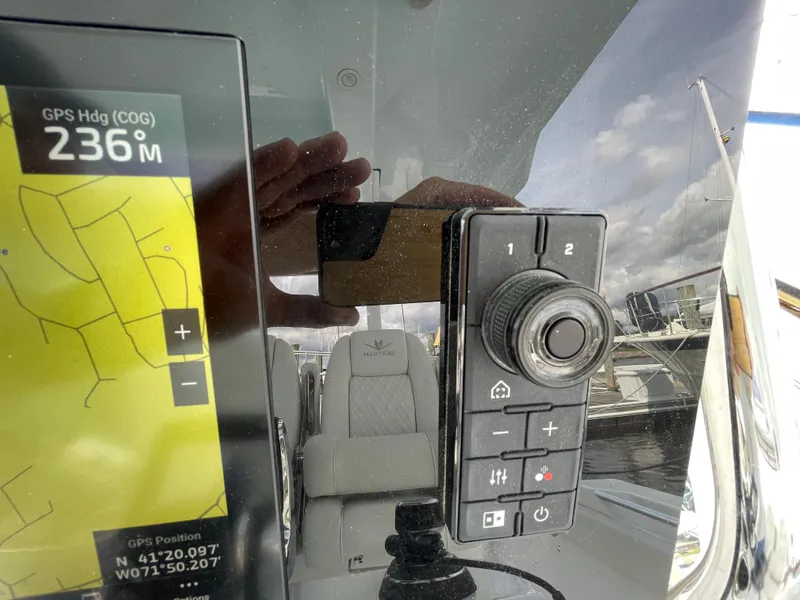 Slide: The Image of Control panel and GPS display on a 2022 Bertram 39 CC boat. - 45