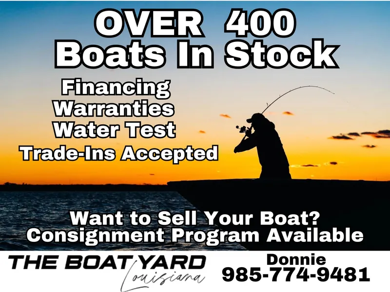 Slide: The Image of Boat dealership advertisement offering financing, warranties, and trade-ins with over 400 boats in stock. - 14