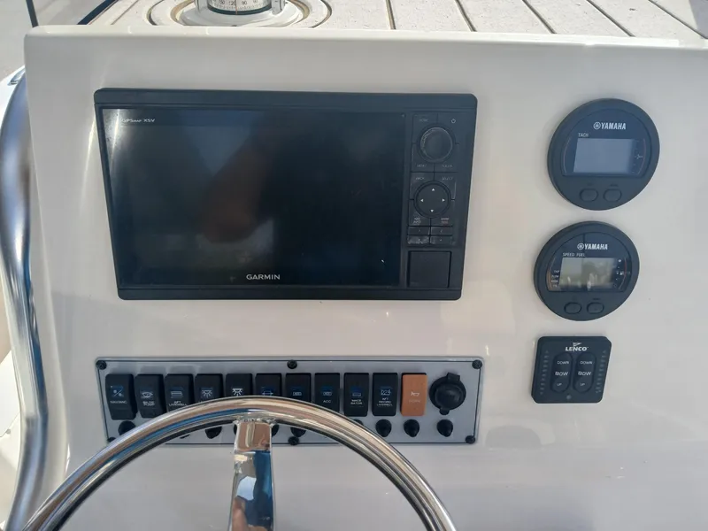 Slide: The Image of Control panel of 2020 Key West 239 boat with Garmin display and Yamaha gauges. - 3