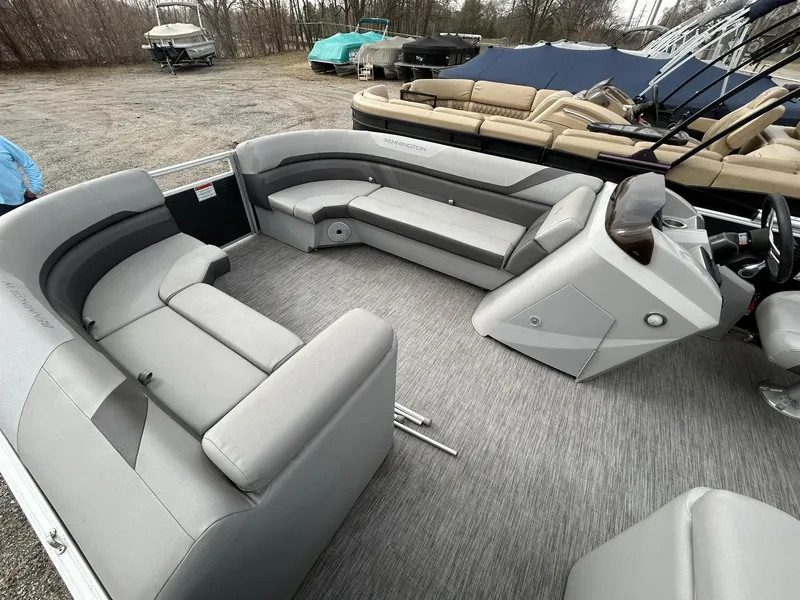 Slide: The Image of 2021 Bennington 21SLX pontoon boat interior with gray seating and helm. - 18