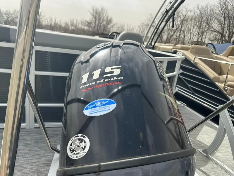 Slide: The Image of Outboard motor on a 2021 Bennington 21SLX pontoon boat, featuring a 115 horsepower engine. - 20