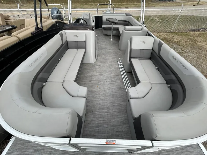 Slide: The Image of 2021 Bennington 21SLX pontoon boat with spacious seating and modern design. - 7