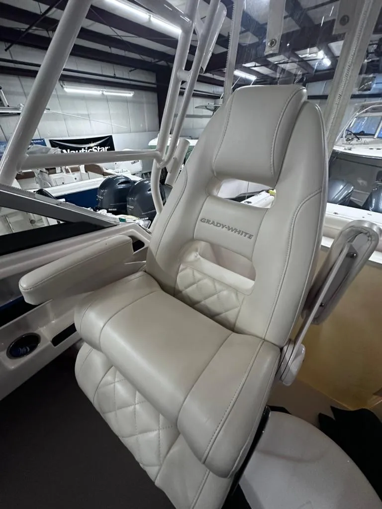Slide: The Image of 2018 Grady-White Marlin 300 boat seat, luxurious white leather upholstery. - 10