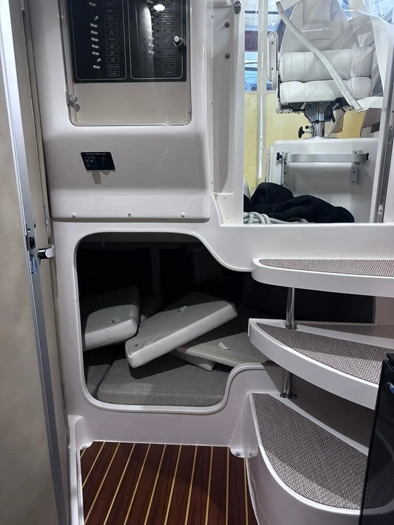 Slide: The Image of Interior view of 2018 Grady-White Marlin 300 boat, featuring storage compartments and seating. - 15