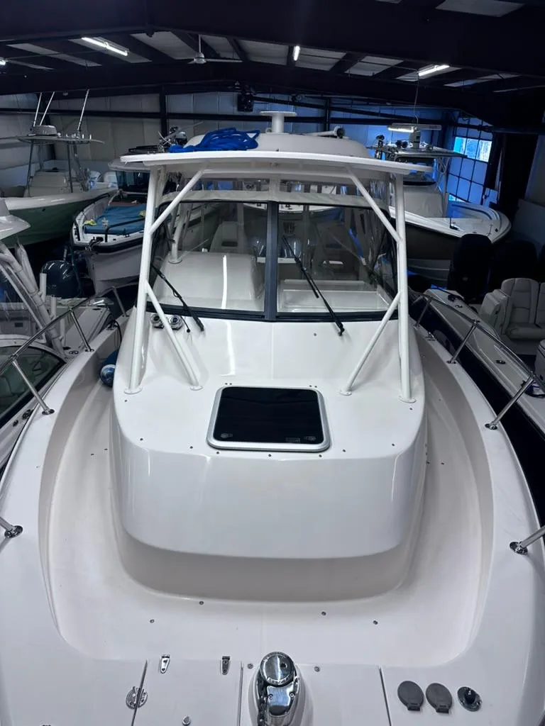 Slide: The Image of 2018 Grady-White Marlin 300 boat in indoor storage facility. - 2
