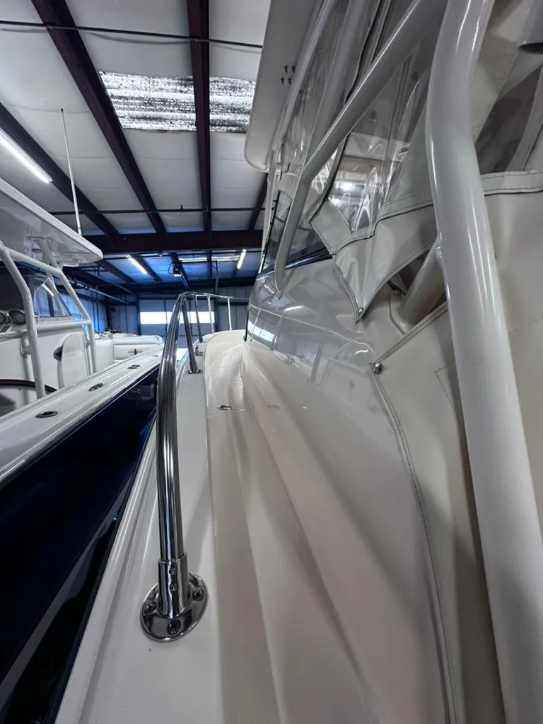 Slide: The Image of 2018 Grady-White Marlin 300 boat in indoor storage, side view. - 5