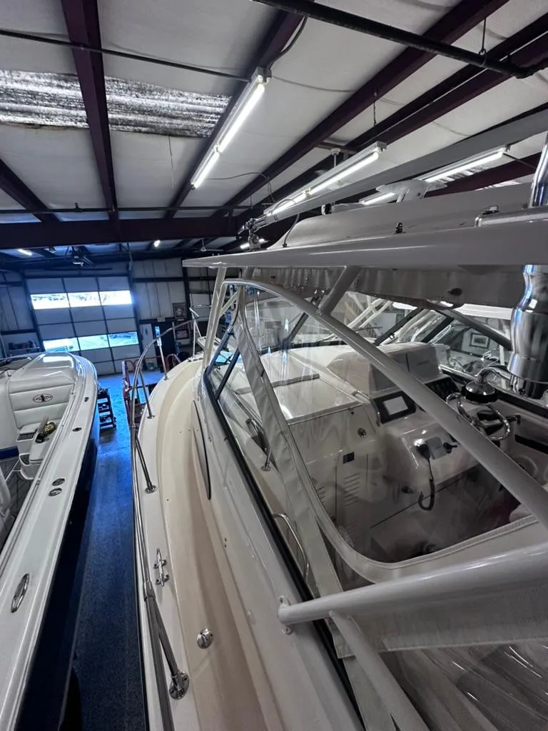 Slide: The Image of 2018 Grady-White Marlin 300 boat in indoor storage facility. - 6