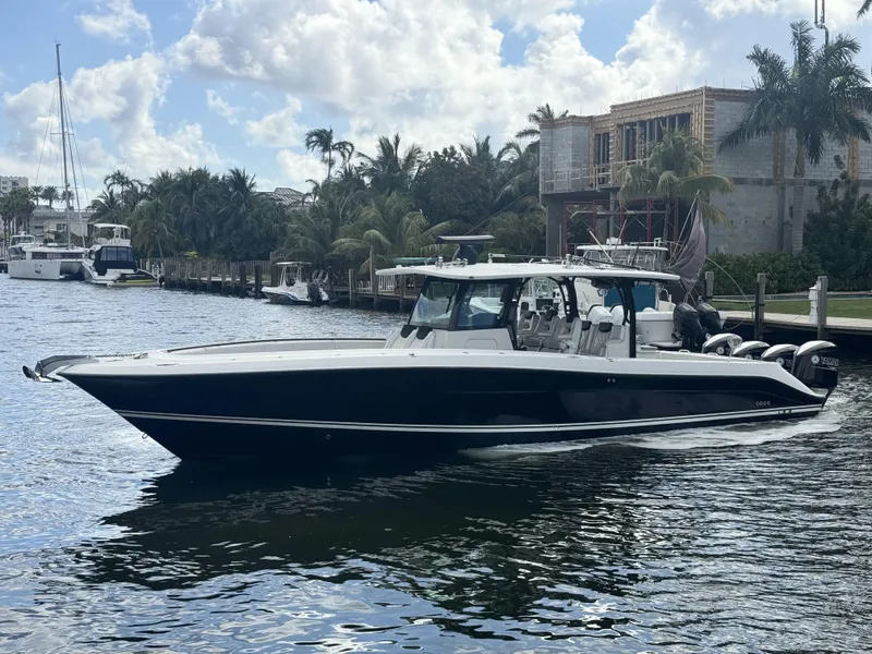 The Image of 2017 Hydra-Sports 4200 Siesta boat on a calm waterway, surrounded by palm trees. - 0