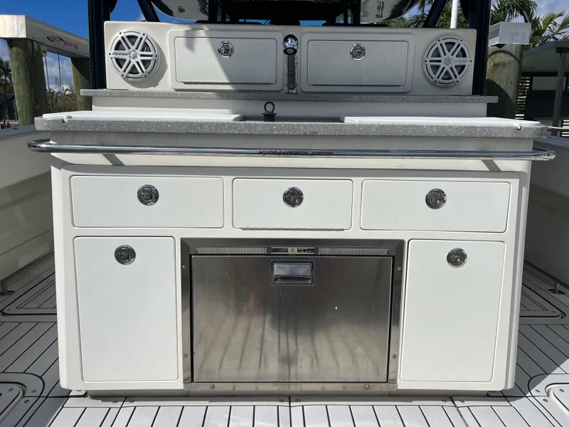 Slide: The Image of 2017 Hydra-Sports 4200 Siesta boat interior with storage and speakers. - 12