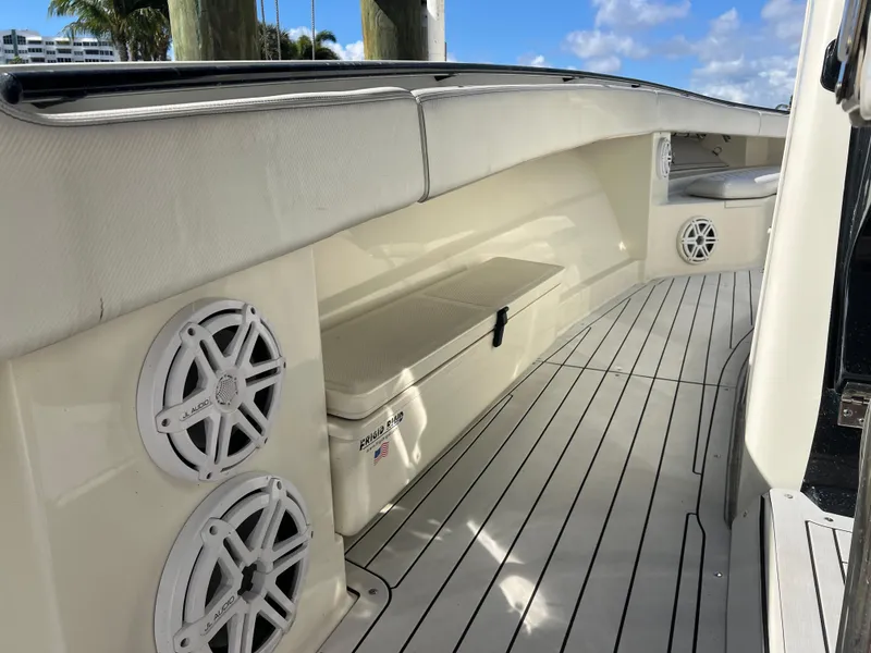 Slide: The Image of 2017 Hydra-Sports 4200 Siesta boat interior with speakers and cushioned seating. - 18