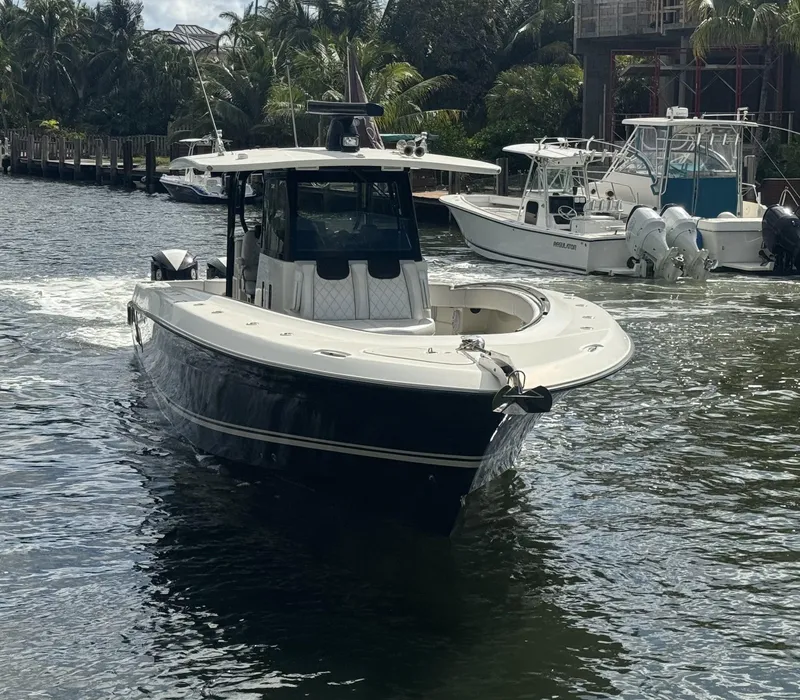 Slide: The Image of 2017 Hydra-Sports 4200 Siesta boat cruising on a scenic waterway. - 2