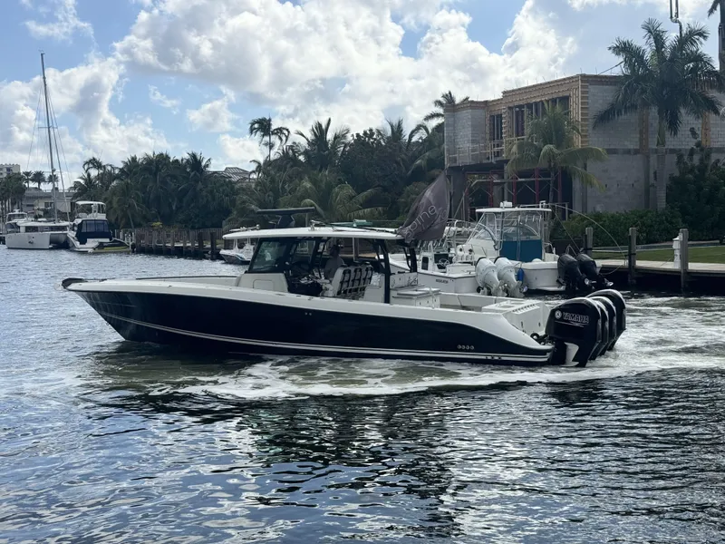 Slide: The Image of 2017 Hydra-Sports 4200 Siesta boat cruising on a sunny day near a marina. - 22