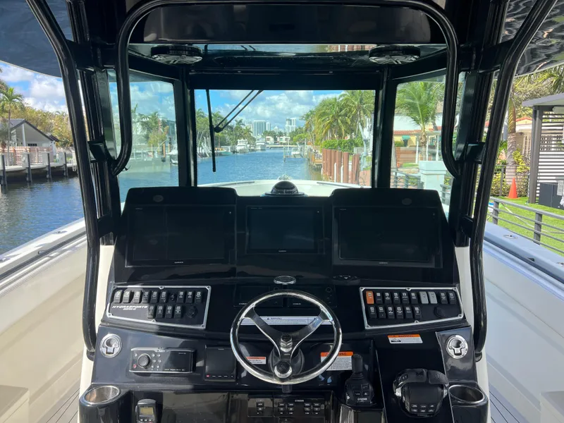 Slide: The Image of Cockpit view of 2017 Hydra-Sports 4200 Siesta boat with advanced navigation controls. - 5