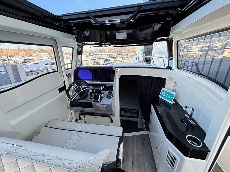 Slide: The Image of Interior of 2025 Navan C30 boat with modern cockpit and seating area. - 17