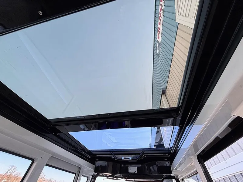 Slide: The Image of Panoramic sunroof of 2025 Navan C30 showcasing clear sky and modern design. - 18