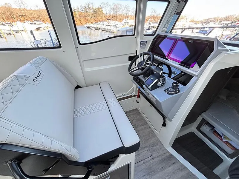 Slide: The Image of Interior of 2025 Navan C30 boat with modern dashboard and comfortable seating. - 19
