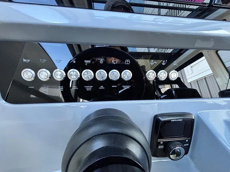 Slide: The Image of Control panel of 2025 Navan C30 boat with buttons and display screen. - 23