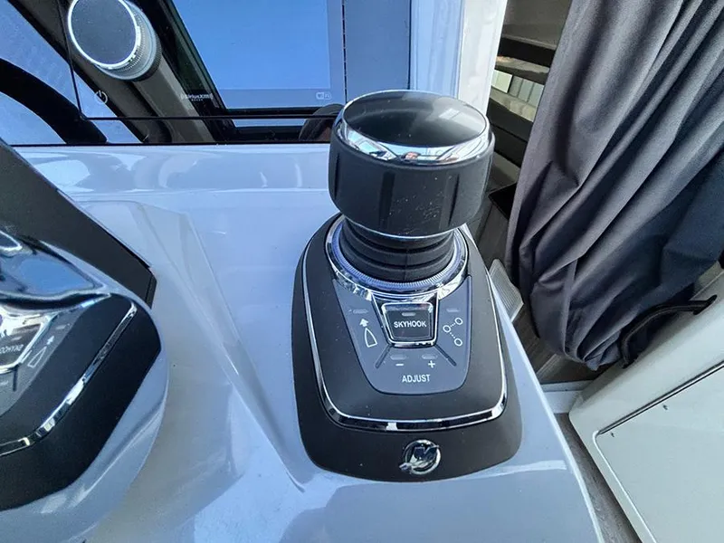 Slide: The Image of Control panel of 2025 Navan C30 boat with joystick and adjustment buttons. - 26