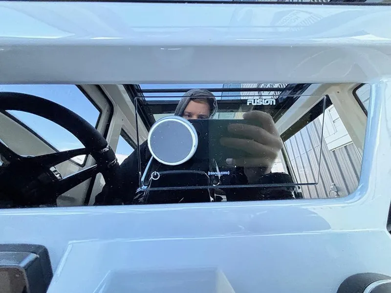 Slide: The Image of Reflection in Navan C30 2025 vehicle window, showcasing interior and steering wheel. - 27