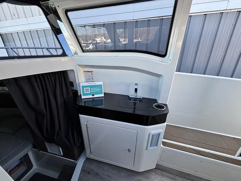 Slide: The Image of Interior of 2025 Navan C30 boat featuring a sleek kitchenette with modern design. - 28