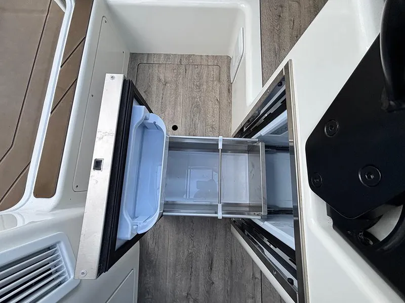 Slide: The Image of Navan C30 2025 interior with open drawer and modern design. - 30