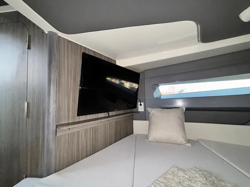 Slide: The Image of Interior of 2025 Navan C30 with modern design, featuring a TV and comfortable seating. - 32