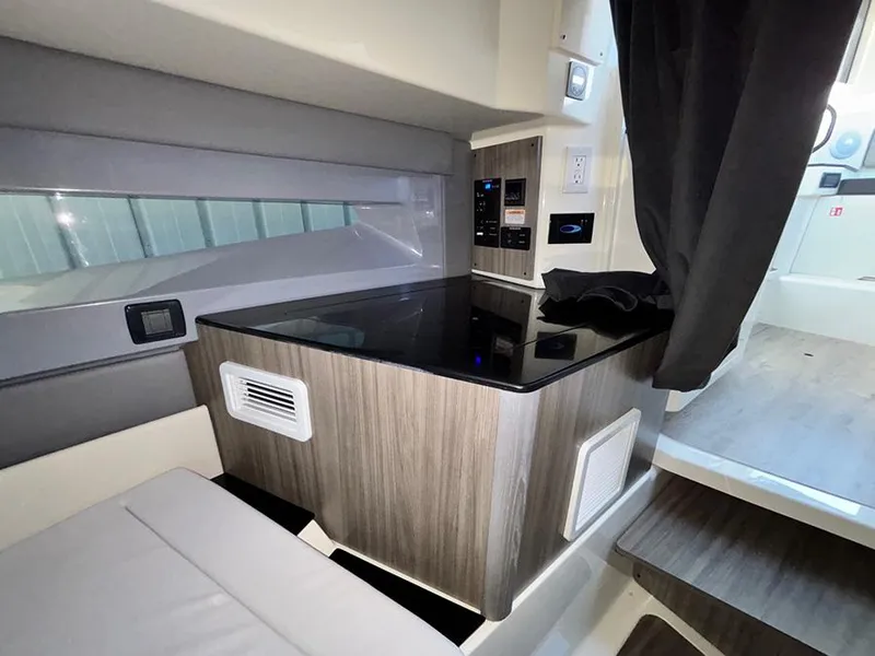 Slide: The Image of 2025 Navan C30 interior with modern wood finish and sleek black countertop. - 33